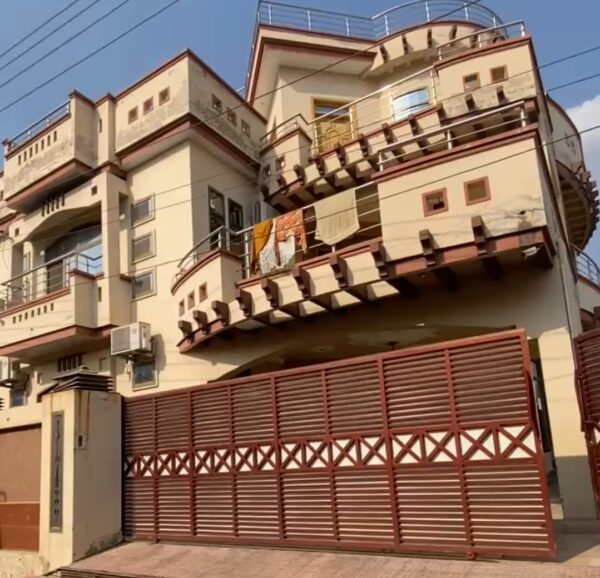 Spacious 5-bedroom house for sale in Chakwal, featuring a large garden and modern design